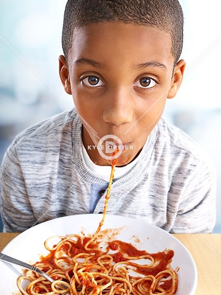 Child Eating Pasta